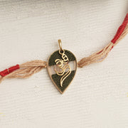 22K Gold Double Om Rakhi with brown & red thread changeable into a pendant