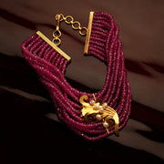 RUBY BEADS BRACELET WITH 22K GOLD FLORA PEARLS ON CENTER